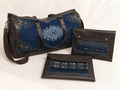 Handmade Duffle Bag and Laptop Cases with upcycled leather and textile panels by Rosanna Gethin
