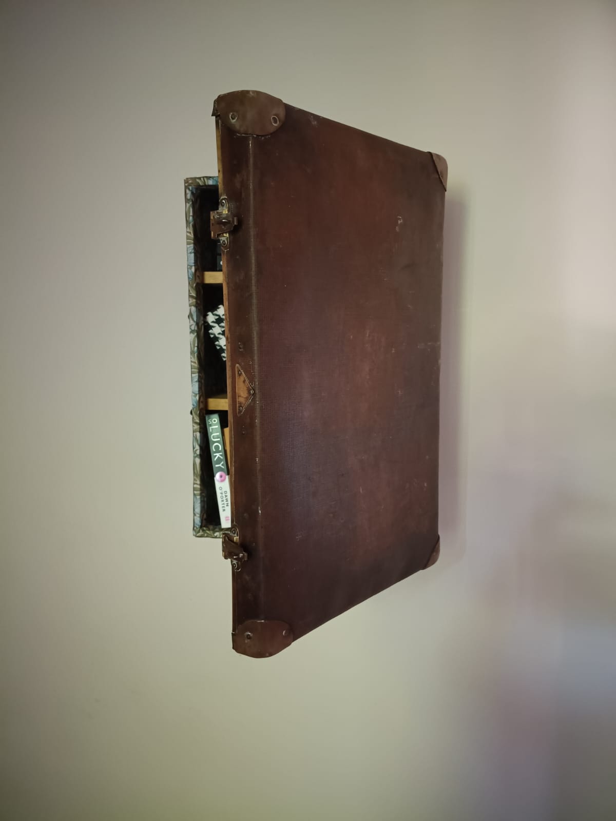 Vintage suitcase storage by Medina Grillo